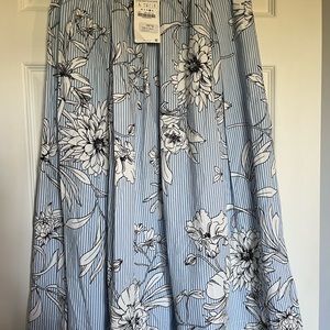 Below knee full skirt in white,blue and black.